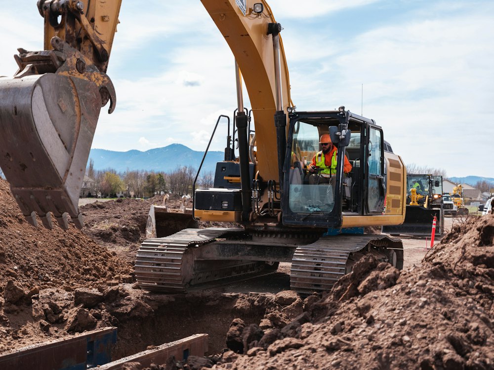 Bulldozer leveling a dirt field