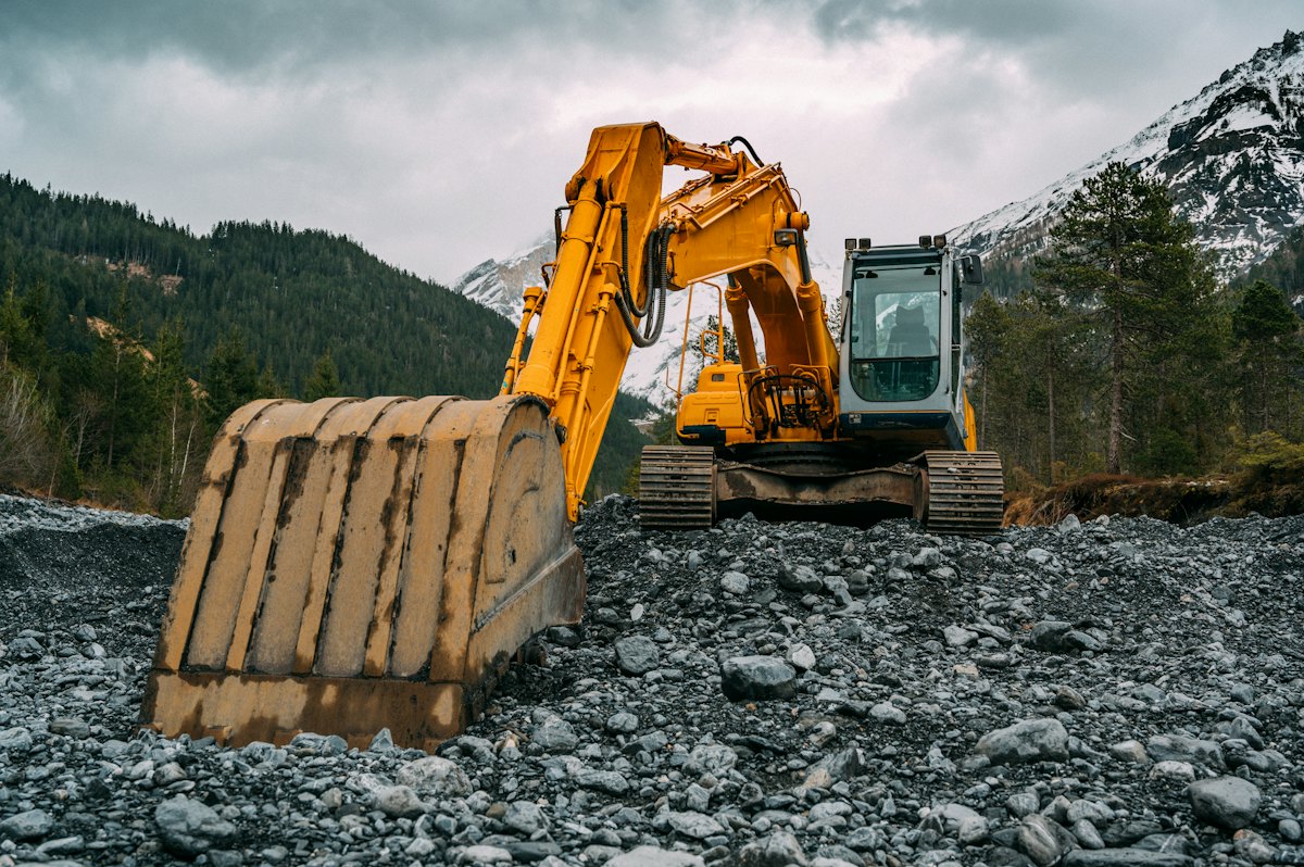 Excavator working on rocky ground
